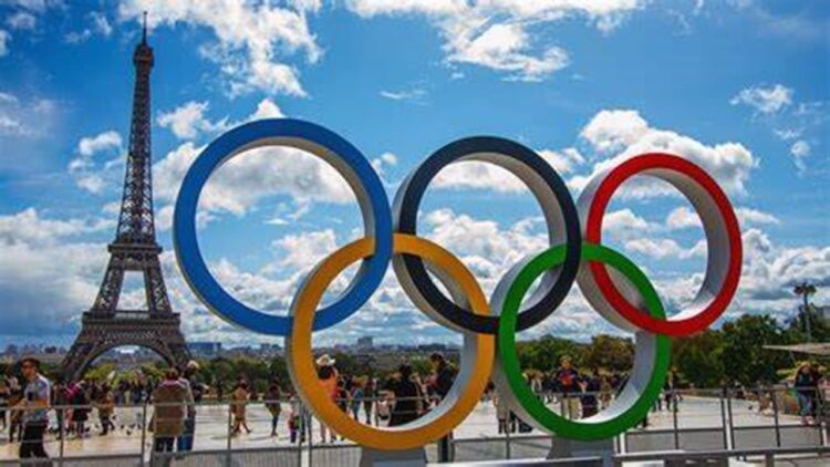 Eiffel Tower Glows in Olympic Hues